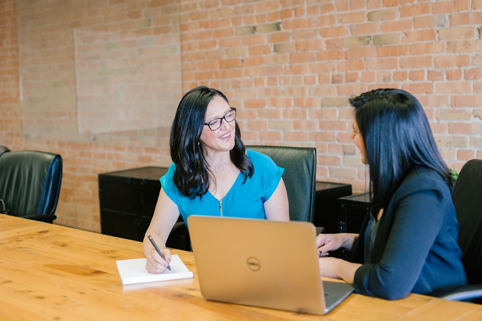 Compliance advisor reviewing identity documents with a client