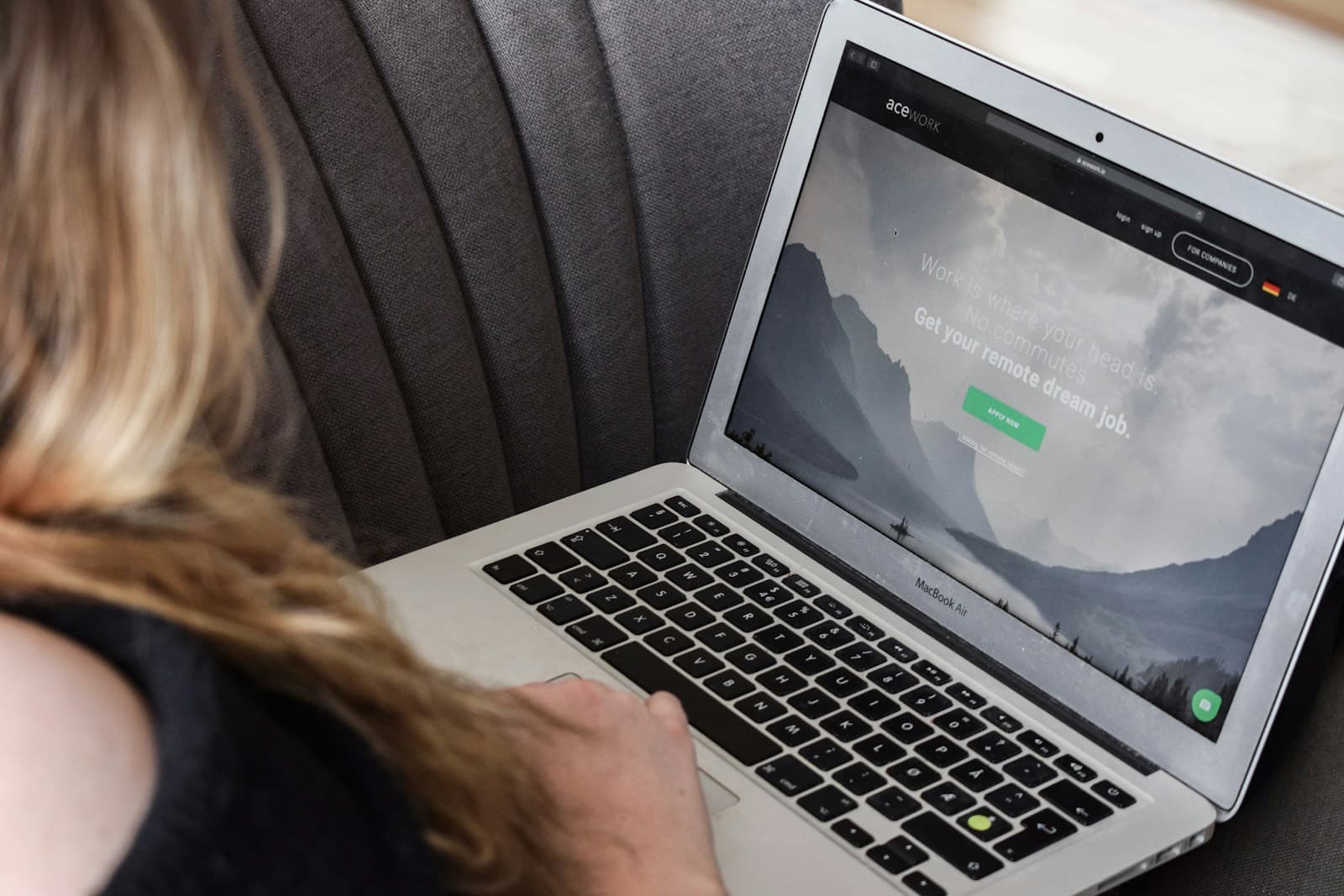 International professional completing remote work on a laptop